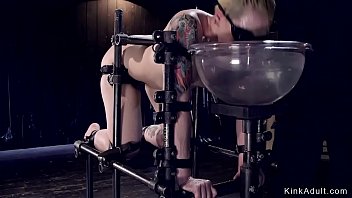 Short haired blonde slave is strapped in device bondage and pussy toyed and vibed with dick on a stick